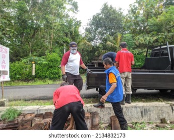 Gunungkidul, Yogyakarta, Indonesia, March 12, 2022: A Community Service Atmosphere Containing Clay Tiles By Natural Disaster Volunteers In Bejiharjo Village.