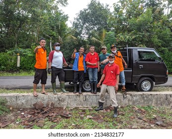 Gunungkidul, Yogyakarta, Indonesia, March 12, 2022: A Community Service Atmosphere Containing Clay Tiles By Natural Disaster Volunteers In Bejiharjo Village.