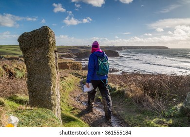 Gunwalloe In Cornwall England Uk. Hiker Walking On The Coast Path