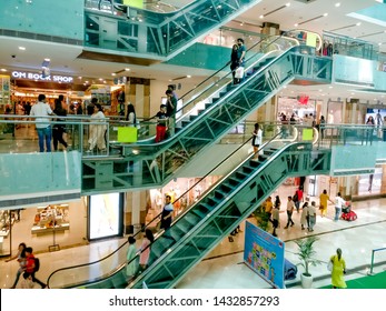 Gurgaon, India - Circa 2019: Aerial Shot Of Shopping Mall In Gurgaon With Kids Activity Happening In The Central Area And People Utilizing The Escalators To Move Between The Floors Filled With Branded