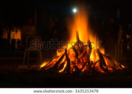 Gurgaon, India, Circa 2020 - Photograph of a giant bonfire lit for the auspicious festival of lohri or Holi or Holika Dahan. This is a spring harvest festival celebrated in India by roasting grain