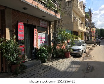 Gurgaon / India - September 26 2019: A Beauty Salon On A Small Street In Downtown Gurgaon On A Hot Afternoon.