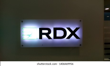 Gurgaon, New Delhi, India - May 24, 2019 - RDX (Remote DBA Experts) logo in corporate office reception area with backlit