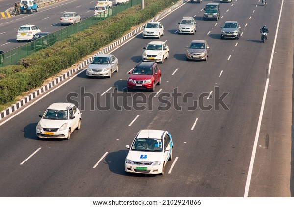 Gurugram, Haryana, India-21\
2021: electric vehicle on road, Traffic on Delhi Jaipur super\
Expressway 