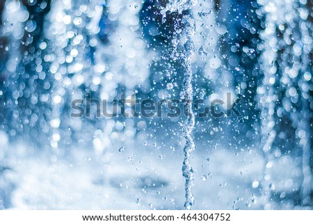 The gush of water of a fountain. Splash of water in the fountain, abstract image.