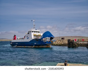 Gutcher, UK - May 8 2022: The interisland roll on - roll off ferry Bigga arriving at the ferry terminal at Gutcher on the island of Yell in Shetland, UK.