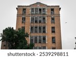 Guthrie, Oklahoma United States - June 10 2024: an abandoned building on a cloudy day 