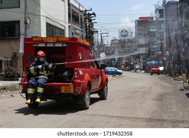 Guwahati, Assam, India. 1 March 2020. A Fire Fighter Spray Disinfectant, During Nationwide Lockdown In The Wake Of Coronavirus Pandemic, In Guwahati.