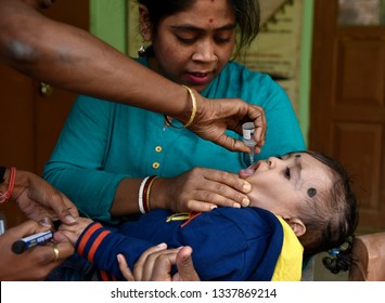 Guwahati, Assam, India. March 10, 2019. An Indian Child Receives Polio Vaccine Drops On National Immunisation Day In Guwahati.