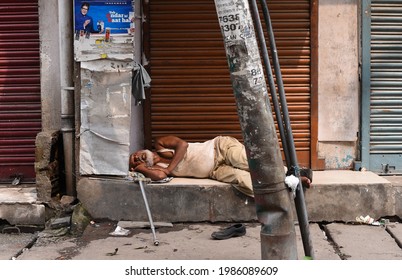 Guwahati, India. 05 June 2021. A Vendor Sleeping In Front Of Closed Shop During Lockdown Due To COVID-19 Coronavirus Pandemic, In Guwahati.