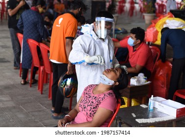 Guwahati, India. 07 June 2021. A Health Worker Takes Swab Sample To Test For COVID-19 Coronavirus Disease Before Vaccination, At A Vaccination Centre In Guwahati.