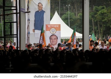 Guwahati, India. 10 May 2022. Supporters Of Bharatiya Janata Party (BJP) Standing Next To A Banner Of Himanta Biswa Sarma As They Attend In A Public Rally  In Guwahati.