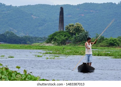 Guwahati,Assam,India - July 28 2019:A Men Paddle A Boat In A Field In Flood-affected Village In Kamrup District