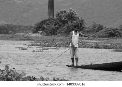 Guwahati,Assam,India - July 28 2019:A Men Paddle A Boat In A Field In Flood-affected Village In Kamrup District