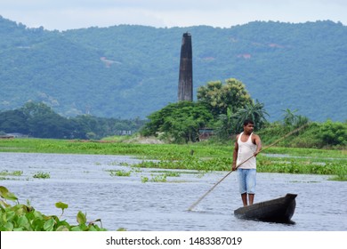 Guwahati,Assam,India - July 28 2019:A Men Paddle A Boat In A Field In Flood-affected Village In Kamrup District