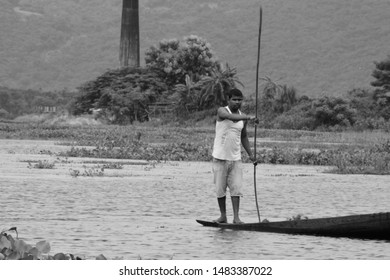 Guwahati,Assam,India - July 28 2019:A Men Paddle A Boat In A Field In Flood-affected Village In Kamrup District