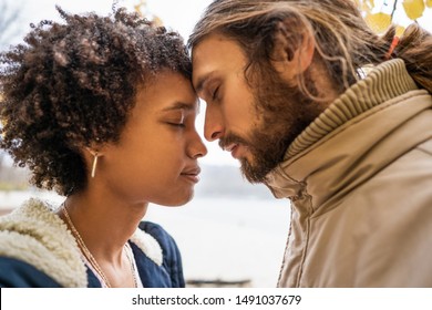 guy with an african american girl in love in autumn park walk at sunset - Shutterstock ID 1491037679