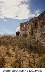 Guy with backpack exploring abandoned building