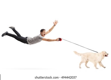 Guy being pulled by his dog isolated on white background
