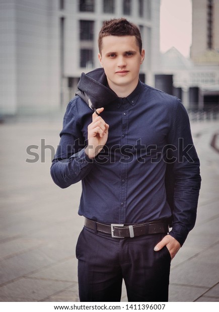 black coat blue shirt