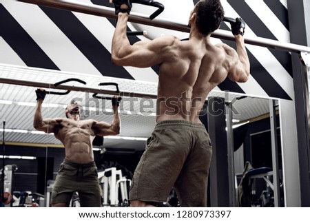 Image, Stock Photo Muscular man doing chin-ups