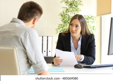 Guy And Businesswoman Talking In A Job Interview In An Office