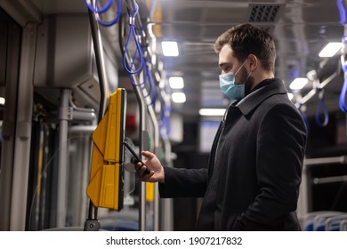 guy buy a ticket on public transport in the terminal using application in mobile phone