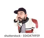 Guy with cap and jacket making funny expressions