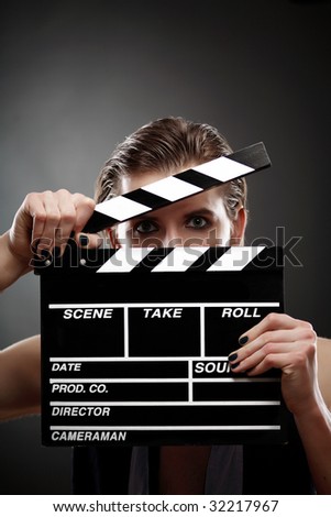 Guy with a clapper, closeup portrait