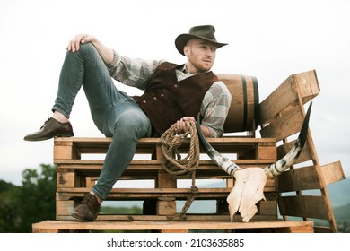 Guy Cowboy. Owner Of Ranch. Farm Worker And Farming Concept. Handsome Man In Cowboy Hat And Rustic Style Outfit. Men Retro Fashion, Vintage Vogue, Brutal Male Model.