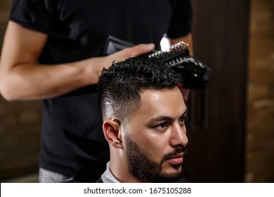 The Guy Is A Dark-haired Asian Indian Appearance On A Haircut In A Barbershop . Cinematic Image