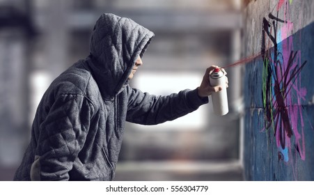 Guy drawing with spray . Mixed media