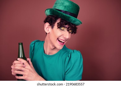 A Guy Dressed As A Drag Queen Drinks Beer. St.Patrick 's Day.