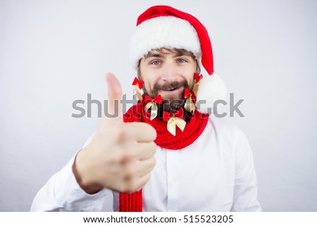 Guy dressed as Santa wearing beard decorated with colorful bows showing thumb up