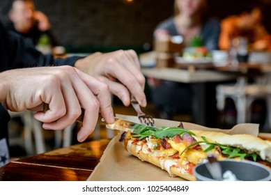 The guy eats a sandwich