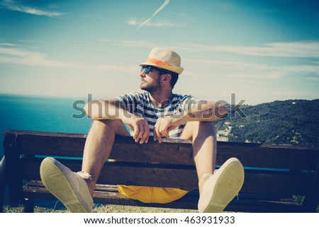 Similar – Man observing something through binoculars