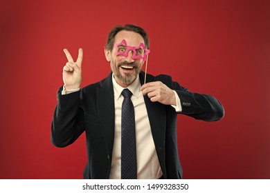 Guy Enjoying Party Carnival. Holiday Party Celebration. Having Fun. Office Party Corporate. Join Carnival. Man Formal Suit Wear Fake Glasses Accessory. Cheerful Businessman In Party Photo Booth Props.