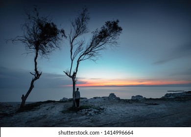 Guy Enjoying Sunset, Back Side View On A Sad Man Looking Away To The Sea, Solitude Or Freedom Concept