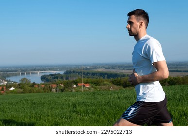 guy facing sideways getting ready for training, nice view, nature, healthy life