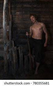 guy with the fork in an old rustic barn