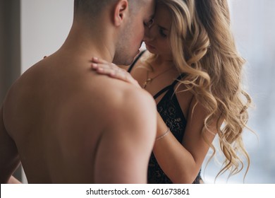 The guy with the girl gently embraces, in underwear - Powered by Shutterstock