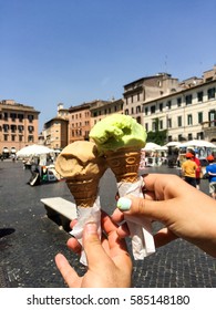 guy with a girl holding an ice cream on the street in Rome,
