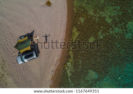 guy and girl on the beach, top view