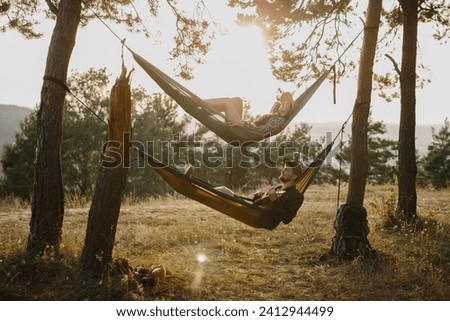 Similar – Foto Bild Young woman relaxing in a hammok