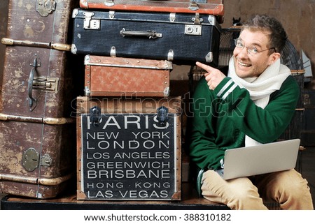 Guy with the glasses and the laptop thinks the bags