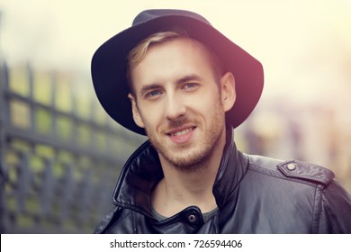 guy in the hat is smiling