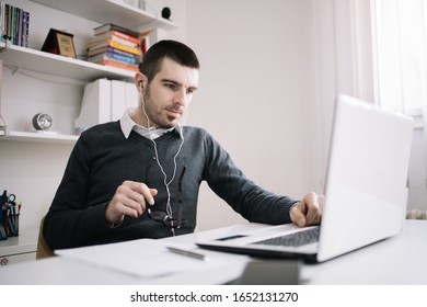 Guy With Headphones Taking An Online Course