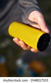 Guy Holding Aluminum Can Yellow With Beverage, Closeup. Mockup For Design