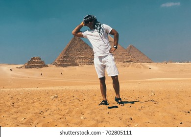 The guy leaned on the pyramid
