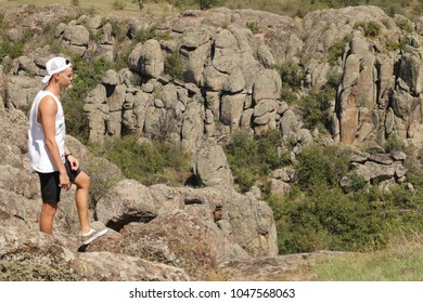 guy on the background of rocks